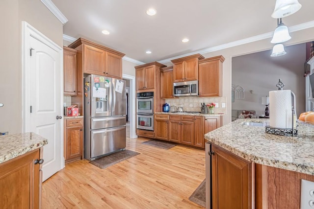 1765 Dew Pl, Marietta, GA 30064 - kitchen featuring stainless steel appliances, ornamental molding, light wood-style floors, brown cabinets, and tasteful backsplash