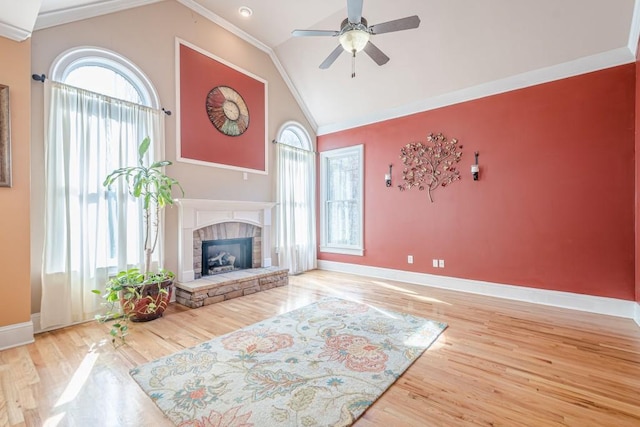 1765 Dew Pl, Marietta, GA 30064 - living area featuring ceiling fan, baseboards, lofted ceiling, a stone fireplace, and wood finished floors