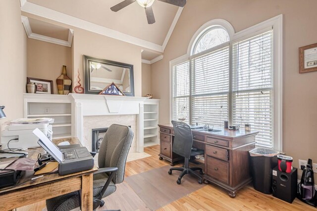 1765 Dew Pl, Marietta, GA 30064 - office area featuring lofted ceiling, a ceiling fan, crown molding, light wood-type flooring, and a fireplace with flush hearth