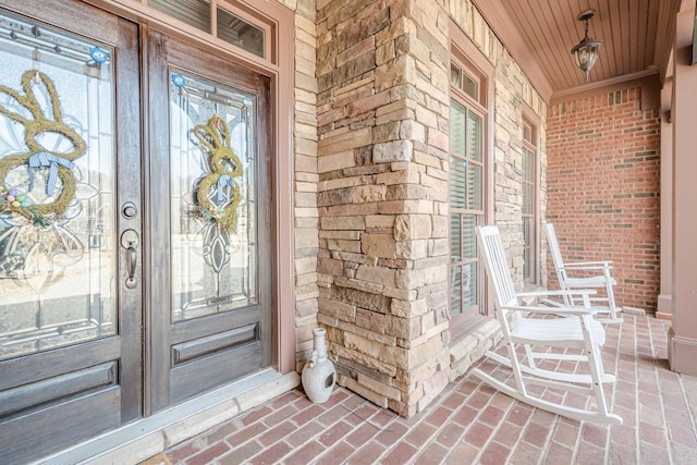 1765 Dew Pl, Marietta, GA 30064 - doorway to property with covered porch, brick siding, stone siding, and french doors