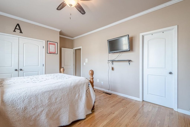 1765 Dew Pl, Marietta, GA 30064 - bedroom with ornamental molding, baseboards, light wood finished floors, a closet, and a ceiling fan