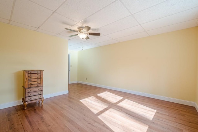1765 Dew Pl, Marietta, GA 30064 - unfurnished room with ceiling fan, wood finished floors, a paneled ceiling, and baseboards