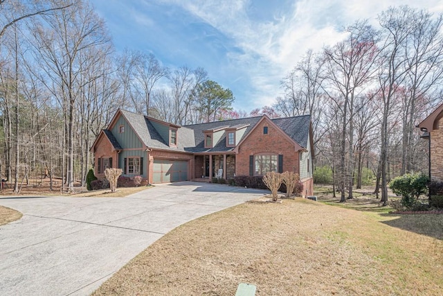 1765 Dew Pl, Marietta, GA 30064 - view of front facade featuring driveway, an attached garage, brick siding, a front lawn, and board and batten siding