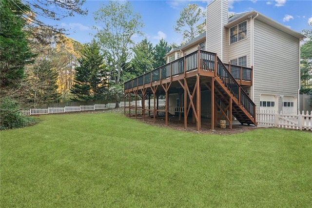 back of house with a wooden deck and a yard