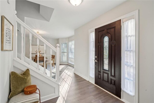 dining area featuring dark hardwood / wood-style floors and a chandelier