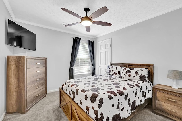 bedroom featuring ornamental molding, light colored carpet, baseboards, a ceiling fan, and a closet