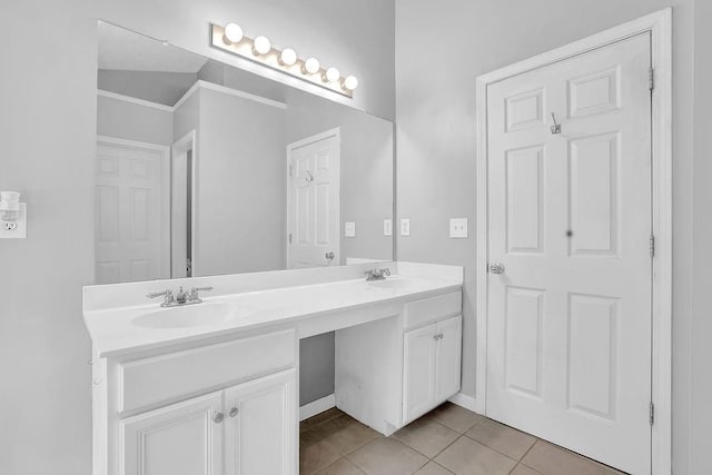 bathroom with tile patterned flooring and double vanity