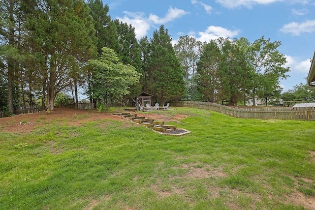 view of yard featuring an outbuilding and a shed