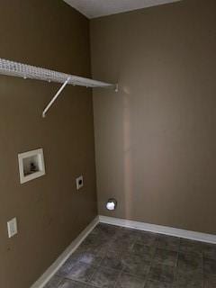 laundry area with electric dryer hookup, hookup for a washing machine, and tile patterned floors