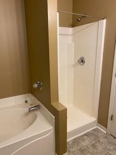 bathroom featuring shower with separate bathtub and tile patterned floors