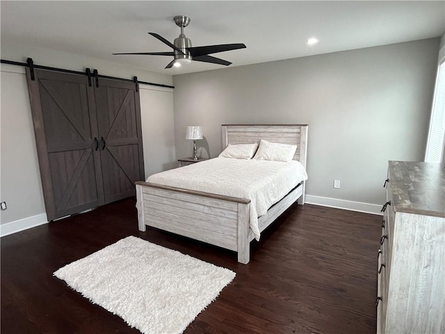 1255 Plaza Ave SW, Atlanta, GA 30310 - bedroom with a barn door, baseboards, dark wood-style flooring, ceiling fan, and recessed lighting