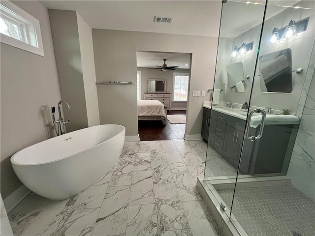 1255 Plaza Ave SW, Atlanta, GA 30310 - bathroom featuring marble look tiles, a soaking tub, double vanity, and baseboards