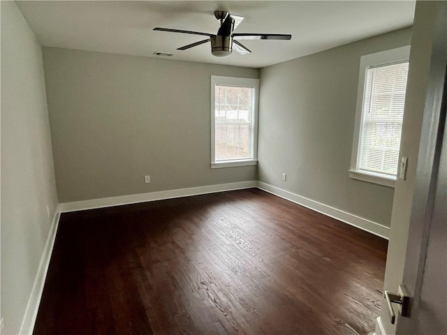 1255 Plaza Ave SW, Atlanta, GA 30310 - empty room featuring dark wood-style floors, a ceiling fan, and baseboards