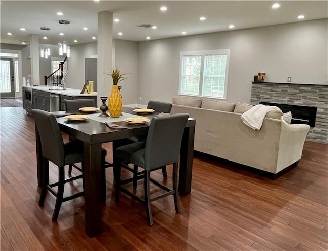 1255 Plaza Ave SW, Atlanta, GA 30310 - dining area with stairway, dark wood-style floors, plenty of natural light, a stone fireplace, and recessed lighting