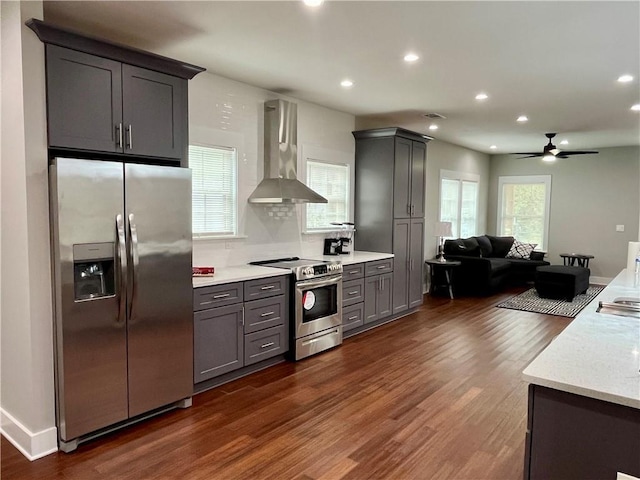 1255 Plaza Ave SW, Atlanta, GA 30310 - kitchen featuring stainless steel appliances, wall chimney range hood, dark wood finished floors, open floor plan, and a ceiling fan