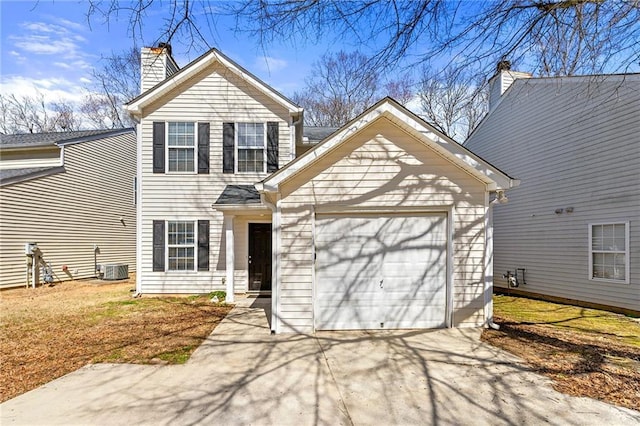 traditional-style home with a garage, driveway, central AC unit, and a chimney