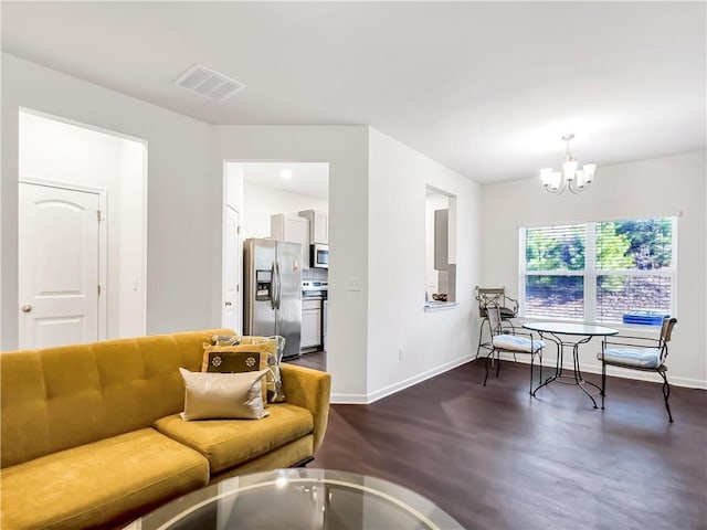 living room with a notable chandelier