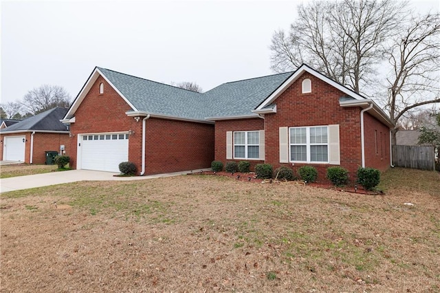 view of front of property featuring a garage and a front yard