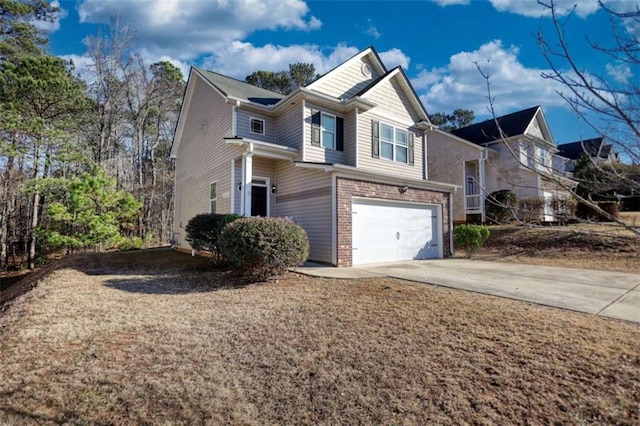 view of front facade with an attached garage, concrete driveway, and brick siding