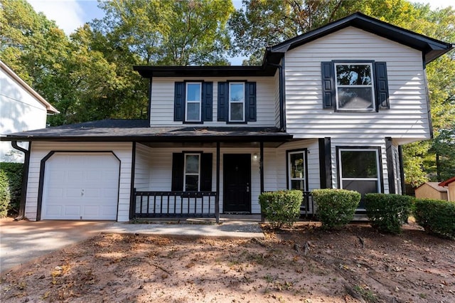 view of front of home with a garage and covered porch