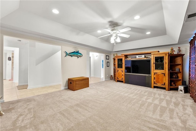 unfurnished living room featuring ceiling fan, recessed lighting, light carpet, visible vents, and a raised ceiling