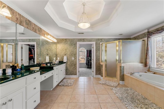 full bathroom featuring visible vents, tile patterned flooring, a spacious closet, a tray ceiling, and vanity