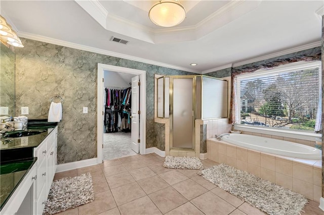 full bath with ornamental molding, vanity, a shower stall, and a spacious closet