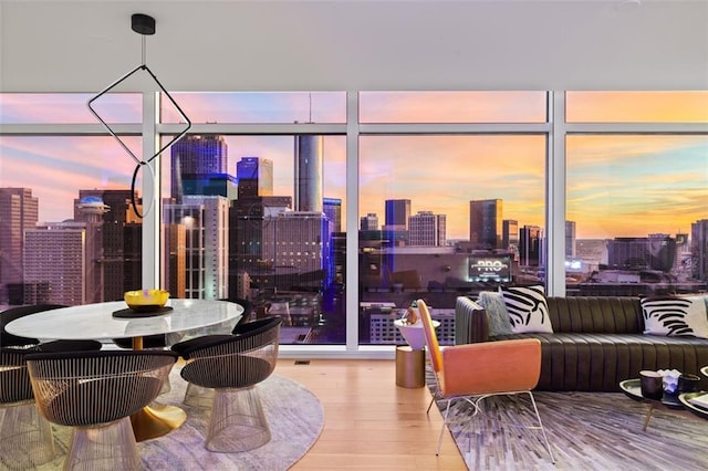 45 Ivan Allen Jr Blvd NW Unit 2505, Atlanta, GA 30308 - dining space featuring a view of skyline and wood finished floors