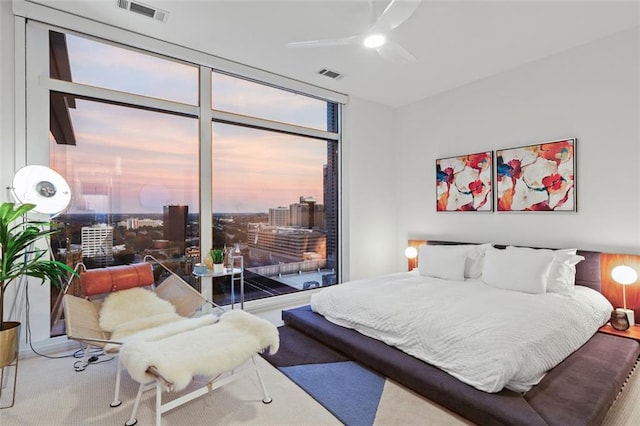 45 Ivan Allen Jr Blvd NW Unit 2505, Atlanta, GA 30308 - bedroom featuring a wall of windows, carpet, and ceiling fan