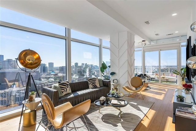 45 Ivan Allen Jr Blvd NW Unit 2505, Atlanta, GA 30308 - living room featuring a skyline view and light wood finished floors