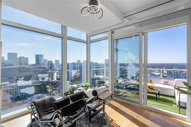 45 Ivan Allen Jr Blvd NW Unit 2505, Atlanta, GA 30308 - sunroom featuring hardwood / wood-style flooring, a skyline view, and expansive windows