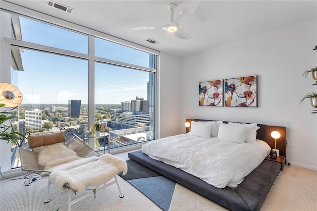45 Ivan Allen Jr Blvd NW Unit 2505, Atlanta, GA 30308 - bedroom with carpet, a city view, a ceiling fan, floor to ceiling windows, and baseboards