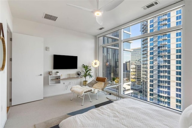 45 Ivan Allen Jr Blvd NW Unit 2505, Atlanta, GA 30308 - carpeted bedroom with ceiling fan and a wall of windows
