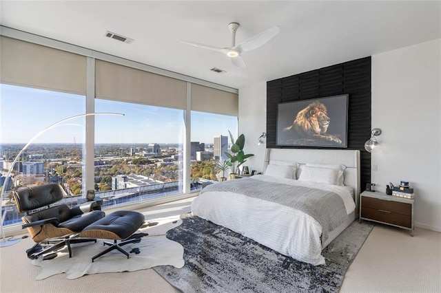 45 Ivan Allen Jr Blvd NW Unit 2505, Atlanta, GA 30308 - carpeted bedroom featuring expansive windows, a city view, and ceiling fan