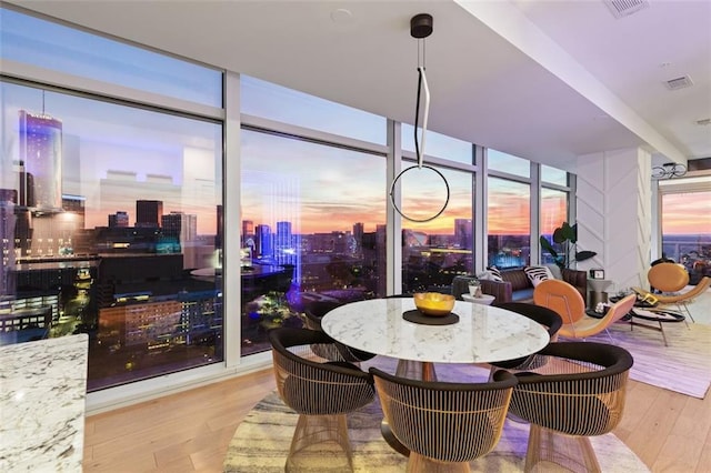 45 Ivan Allen Jr Blvd NW Unit 2505, Atlanta, GA 30308 - dining space featuring a wall of windows, wood finished floors, and a view of city