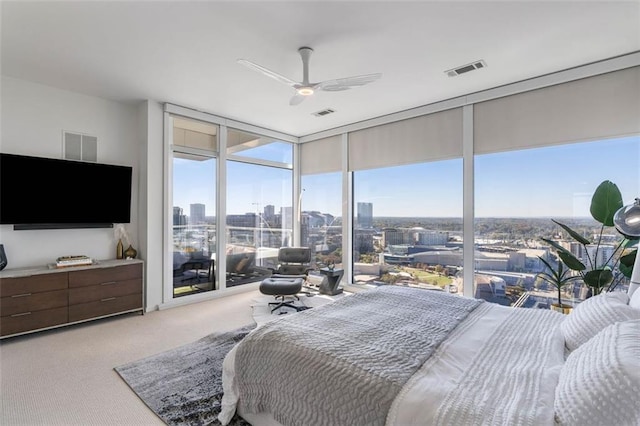 45 Ivan Allen Jr Blvd NW Unit 2505, Atlanta, GA 30308 - carpeted bedroom featuring expansive windows and ceiling fan