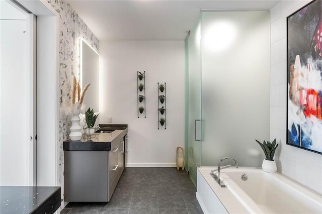 45 Ivan Allen Jr Blvd NW Unit 2505, Atlanta, GA 30308 - full bathroom with vanity, a garden tub, a shower stall, tile patterned flooring, and baseboards