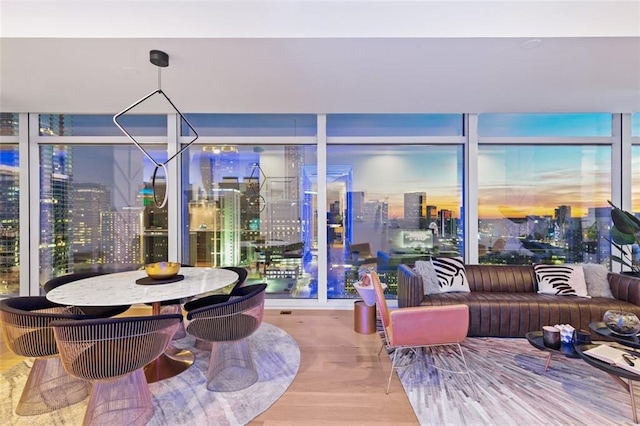 45 Ivan Allen Jr Blvd NW Unit 2505, Atlanta, GA 30308 - dining space featuring wood finished floors and a wall of windows