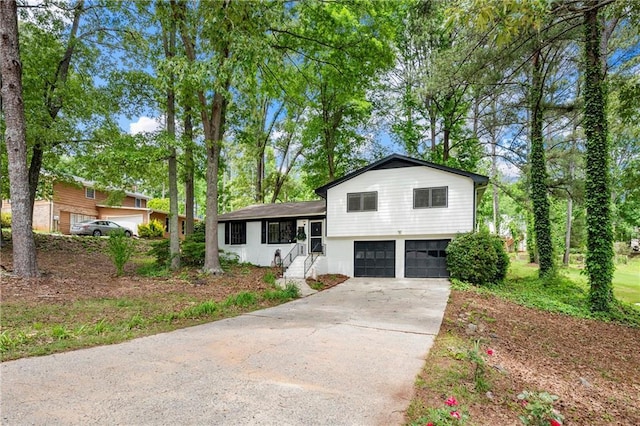 split level home with a garage and driveway