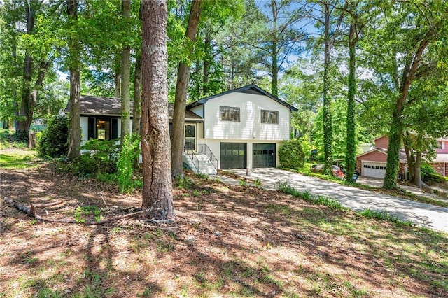 split level home featuring a garage and driveway