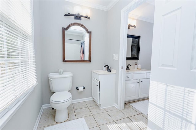 bathroom with toilet, crown molding, tile patterned flooring, baseboards, and vanity