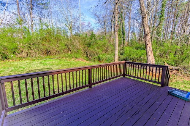 wooden deck with a lawn