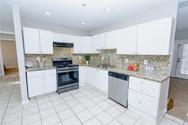 kitchen with visible vents, range hood, appliances with stainless steel finishes, white cabinetry, and a sink