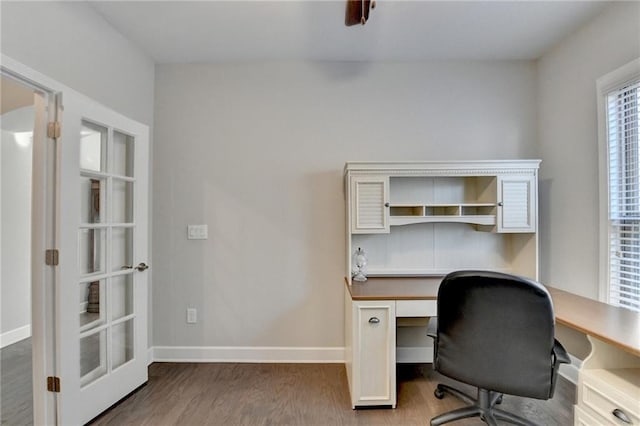 unfurnished office with wood-type flooring