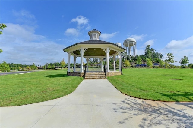 surrounding community with a lawn and a gazebo