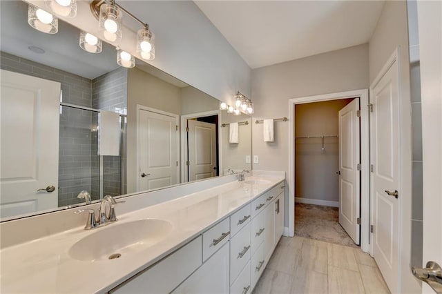 bathroom featuring vanity, tile patterned floors, and a shower with door