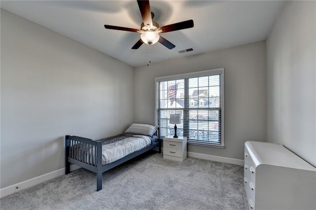 carpeted bedroom featuring ceiling fan