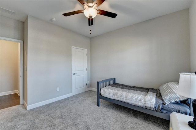 bedroom featuring ceiling fan and light carpet