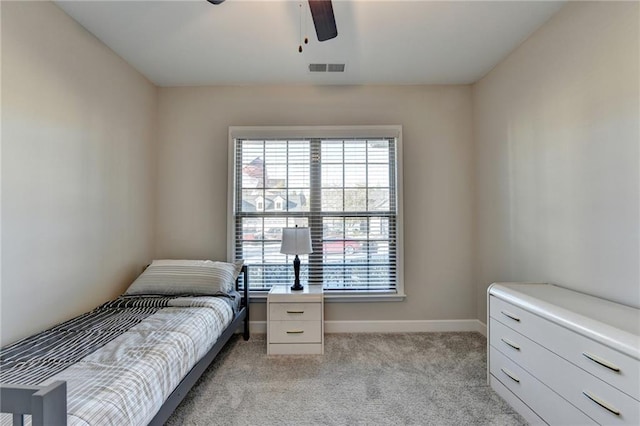 bedroom featuring ceiling fan and light colored carpet