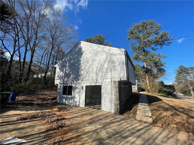 view of property exterior featuring a wooden deck